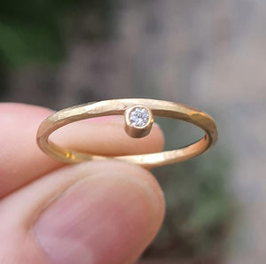 On the side. Raw gold band